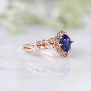 Tanzanite Ring- 14K Rose Gold Vermeil by Aquamarise featuring a deep violet-blue gemstone with intricate vintage-inspired diamond accents on a delicate rose gold vermeil band.