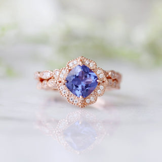 Tanzanite Ring- 14K Rose Gold Vermeil by Aquamarise featuring a cushion-cut violet-blue tanzanite surrounded by a vintage-inspired diamond halo on an intricate rose gold vermeil band.