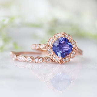 Tanzanite Ring- 14K Rose Gold Vermeil by Aquamarise featuring a vibrant violet-blue cushion-cut gemstone framed by a vintage-inspired rose gold band with diamond accents.
