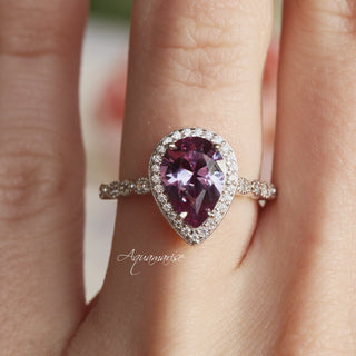 Vintage Teardrop Alexandrite Ring in Sterling Silver by Aquamarise, featuring a pear-shaped purple alexandrite center with a pavé diamond halo and sparkling sterling silver band.