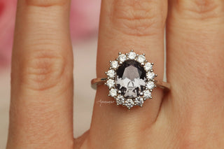 Diana Simulated Gray Diamond Ring in Sterling Silver by Aquamarise featuring an oval gray diamond surrounded by a halo of bright white stones on a slender silver band.