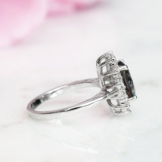 Diana Simulated Gray Diamond Ring in Sterling Silver by Aquamarise featuring a vintage-inspired halo setting with an oval gray simulated diamond on a polished sterling silver band.