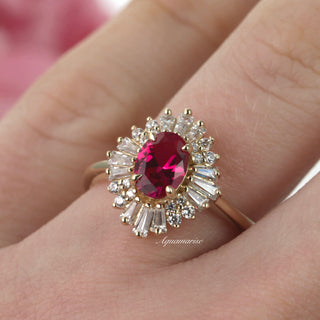 Victoria Natural Ruby Engagement Ring in 14K Solid Yellow Gold by Aquamarise Gold, featuring an oval ruby center with radiant moissanite accents in a vintage-inspired design.
