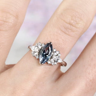 Adeline Marquise Cut Alexandrite Ring in Sterling Silver by Aquamarise featuring a color-shifting marquise alexandrite center surrounded by sparkling diamond accents on a sleek band.