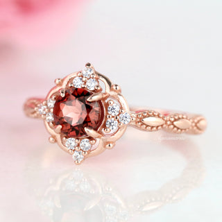 Garnet Ring- 14K Rose Gold Vermeil by Aquamarise featuring a rich red garnet center with ornate antique-inspired rose gold vermeil setting accented by sparkling stones, ideal for January birthstone jewelry.