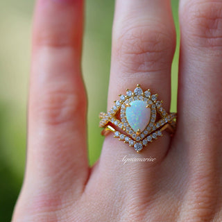 Teardrop White Fire Opal Ring Set in 14K Yellow Gold Vermeil featuring a glowing pear-shaped opal center surrounded by sparkling diamond accents in a vintage-inspired Aquamarise design.