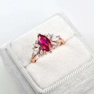 Adeline Marquise Ruby Flower Ring in 14K Rose Gold Vermeil by Aquamarise featuring a marquise lab-grown ruby center with accent stones on a rose gold vermeil band.