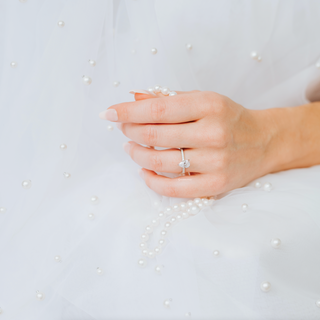 Pear Moissanite Engagement Ring in 14K White Gold (Hidden Halo)